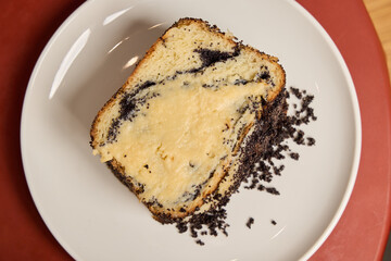 A Delicious Slice of Marble Cake Positioned on a Plate Surrounded by Chocolate Crumbs