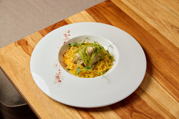 Gourmet Chicken Risotto Lovingly Served in an Elegant White Plate for a Beautiful Presentation