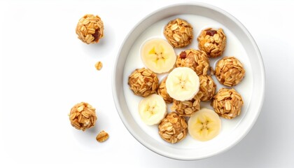 A top-down view shows a white bowl with milk, oat balls and banana slices arranged inside. A few oat balls are scattered to the bowl's left