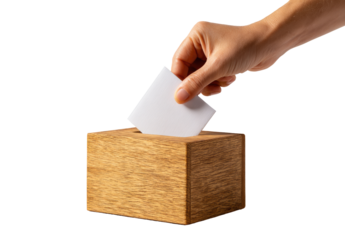 A hand places a blank ballot into a wooden box