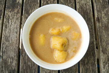 Pengat pisang, a traditional Malaysian dessert of banana simmered in coconut milk and palm sugar.