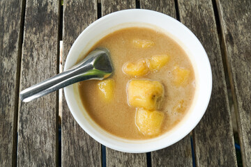 Pengat pisang, a traditional Malaysian dessert of banana simmered in coconut milk and palm sugar.