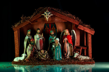 Christmas christian nativity scene. Christmas manger scene with figurines including Jesus, Mary,...