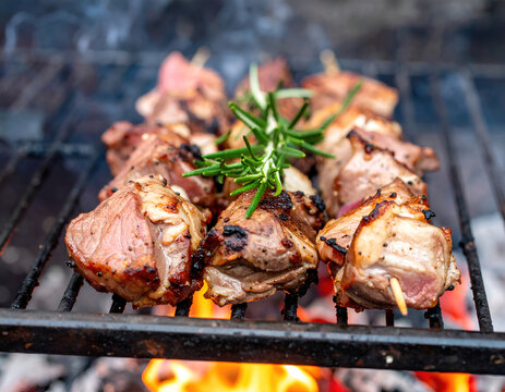 Grilled Lamb Skewers with Rosemary and Spices on a Brazier