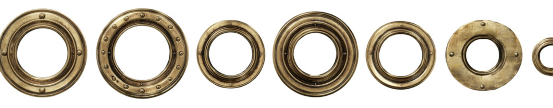 Close-up view of various sizes of vintage brass circular metal grommets arranged in a row