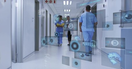 nurse with chart and doctor scrolling tablet spawning overlays reviewing data in hospital corridor - Powered by Adobe