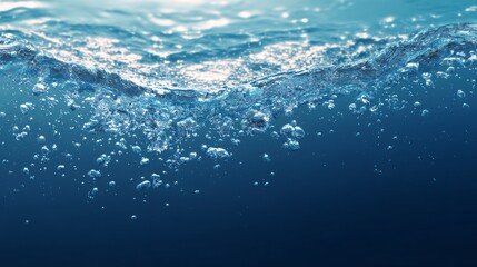 Crystal clear tropical ocean with gentle waves lapping on a pristine sandy shore at sunset