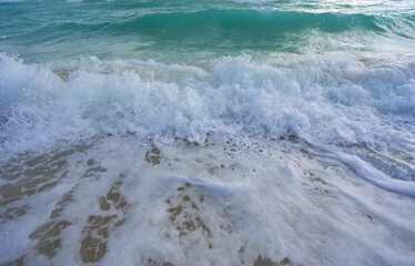 Ocean waves, summer coastline background. Stormy sea waves. Summer sea beach wave. Foamy ocean waves. Summer ocean breeze. Dreamy summer beach background. Ocean splash waves.