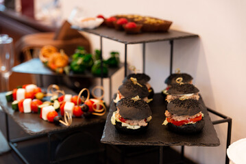 Gourmet appetizers on slate trays