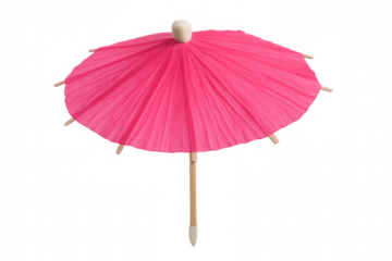 Pink cocktail umbrella decorating refreshing tropical drink, standing against transparent background with playful summer vibe