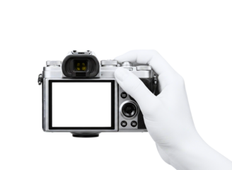 Hand holding a white digital camera with a blank screen isolated on transparent background