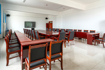 Conference room with long tables and chairs for meetings