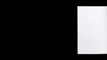 Curled white paper sheet on black - Powered by Adobe