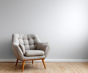 A stylish, light gray armchair sits gracefully against a neutral backdrop, highlighting the simple elegance of modern interior design.