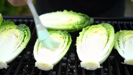 Basting Green Cabbage Halves on a Hot Grill for Healthy Cooking
