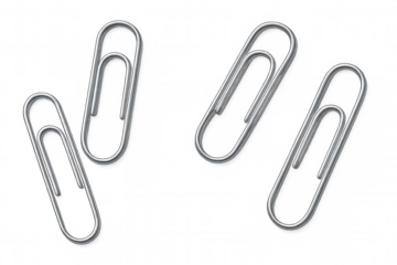 Four metallic paperclips lying on a transparent background, ready for use in office or school projects