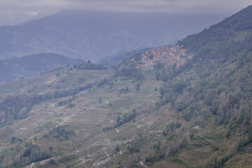 Obraz premium Beautiful sunset over Yuanyang Rice terraces in Laohuzui area, Yunnan, China. UNESCO World heritage site
