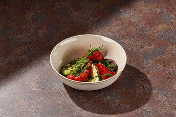 Grilled vegetables with pesto, bright lighting, overhead composition