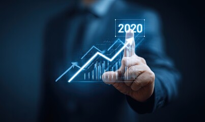Businessperson touches projected 2020 growth chart