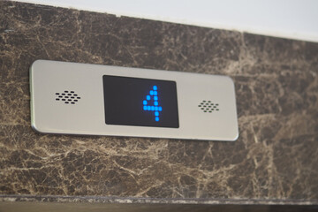 Electronic display shows fourth floor in modern elevator © Towfiqu Barbhuiya 