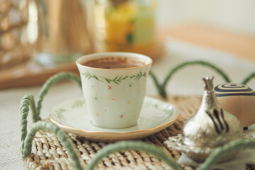 Turkish Coffee served in a decorative cup with saucer on a table