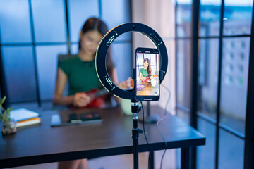 Content creator Young asian woman influencer creating content in home studio entertainment and communication blogger video record with smartphone for online vlog