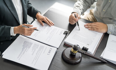 Lawyer Legal counsel presents to the client a signed contract with gavel and legal law. justice and...