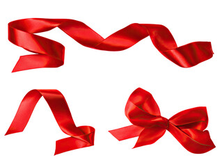 Red satin ribbon streamers and bow, isolated on black