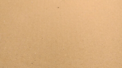 Background of brown kraft paper or cardboard texture, close up of cardboard texture background.