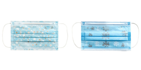 Two Blue Medical Masks with Snowflake and Decorative Pattern Against Transparent Background