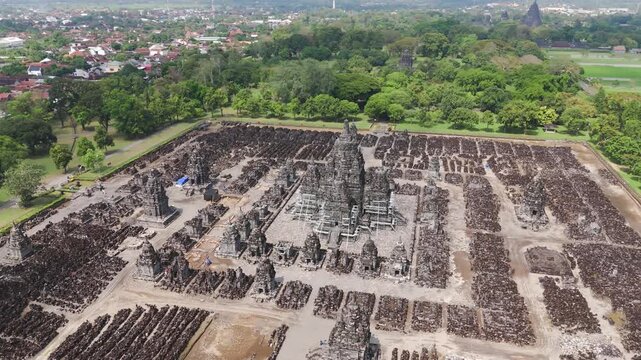 Aerial: Sewu Temple in Prambanan temple compound during the day in the Special Region of Yogyakarta, Java, Indonesia, orbit drone shot