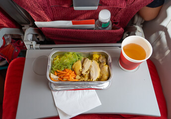 close up on airline food on economy class airplane