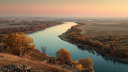 Autumn river winds through golden plains at dawn