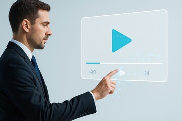 A man in a suit interacts with a holographic video player interface, touching the play button.
