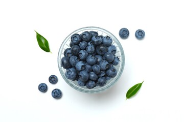 Bowl with fresh blueberries on white background. Top view