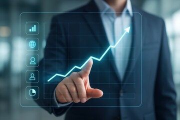 A hand points to a rising graph displayed on a transparent screen, highlighting progress and success.