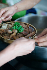 Serving Thai-style braised beef hot pot