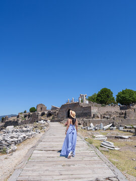 Lifestyle, Asian woman tourist take a holiday for travel in summer at Acropolis of Pergamon Ancient Greek City, Landmark of Tourism Turkiye, Izmir, Turkey. She is walking and enjoy relax vacation.