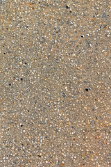 Vertical seashell sand texture background with colorful shell fragments