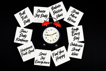 Alarm Clock Surrounded with Message about Happy Life Concept