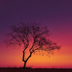 Lone tree silhouette against a vibrant sunset