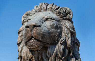 Fototapeta premium Large stone lion statue at Macedonia Square in central Skopje, North Macedonia