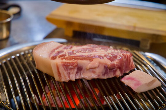 Close‑Up Pork on Charcoal