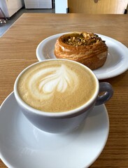Close-up of cup of coffee and cookie