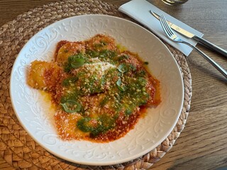 Close-up of ravioli pasta meal. Top view eat from Italy for lunch dish with tomato sauce on a plate