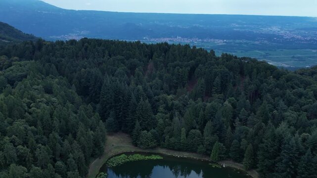 Aerial Scenic view Meugliano Lake in Val di Chy or Valchiusella, near Brosso town, Ivrea, Italy slow motion drone shot