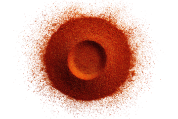 Circular, orange-brown structure surrounded by a scattering of small specks.  A dark void/hole in the center of the structure