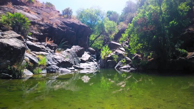 Charco las Vinas in Oj&eacute;n, Andalusia, Spain, small lake in between the rocks