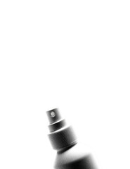 Close-up of a spray bottle top against a black background.  The spray nozzle and top portion of a light gray or silver spray bottle are highlighted against a deep black backdrop. 