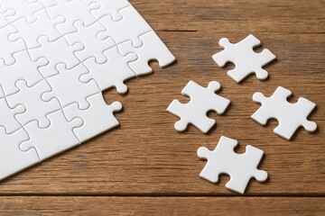 White Puzzle Pieces on Wooden Surface, Imagination and Creativity, Empty Space for Text or Design, Jigsaw Puzzle Concept, Minimalistic Style